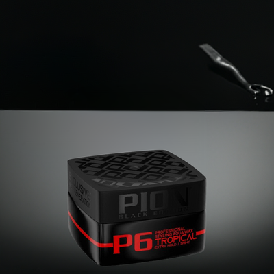 Pion Hair Styling Aqua Wax in a black container on a reflective surface, offering strong hold and glossy finish for all hair types.